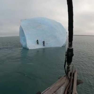 2 guys try climbing a floating glacier