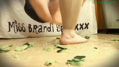 Heavy woman crush cucumbers (camera shakes)