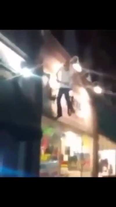 His friends are going to buy him a shot if he sits on the bike.