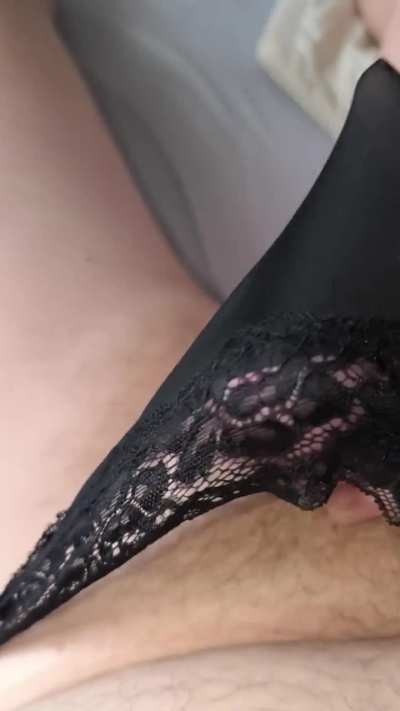 Playing in black thong