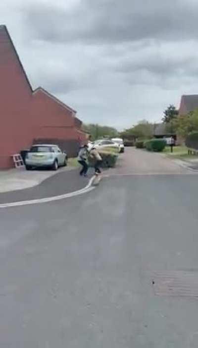 Two men fight in the street with knives