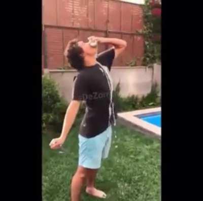 Moron opens a beer can by stabbing it