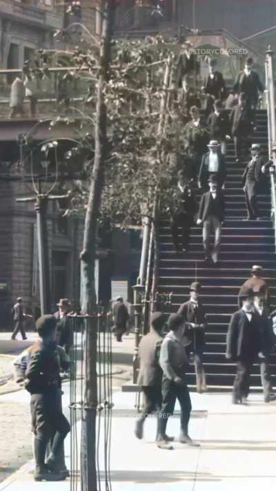Restored footage from 1896 of pedestrians walking down the stairs of a foot-bridge onto the streets of New York City, United States. This footage was filmed by pioneering French filmmaker Alexandre Promio, who worked for the Lumière brothers assigned to m