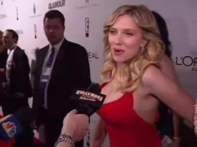 A woman completely disappeared behind Scarlett Johansson on the red carpet