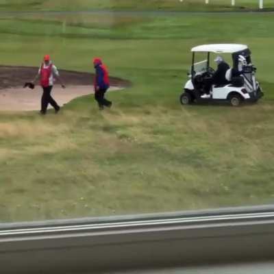 Trump caught cheating at golf with his caddie's help