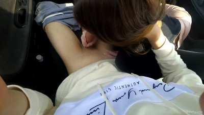 Brunette gives POV blowjob in a car