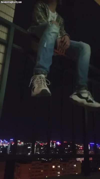 Russian teen throws himself off building