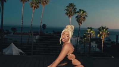 Latto in a black dress