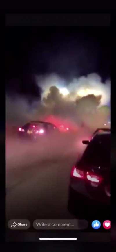 Police tear gas peaceful protestors chanting “hands up, don’t shoot” in Iowa City, IA