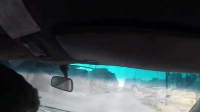 Car drives right though a Russian cluster strike. Douma, Syria November 2017