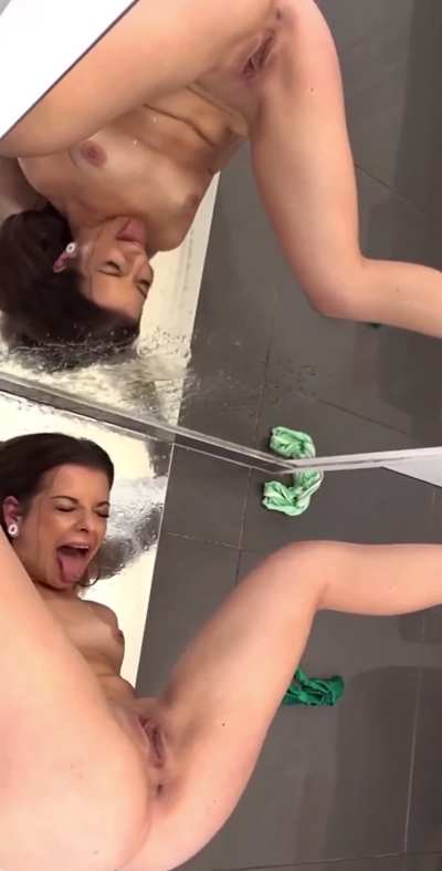 Peeing on her reflection