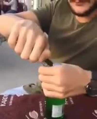 Trying to open a crown cap with a phone