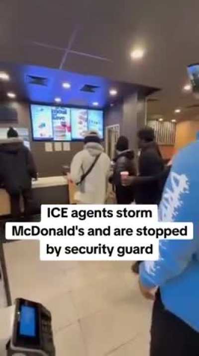 Security guard stops ICE from entering employee area at McDonalds in Minneapolis, Minnesota.