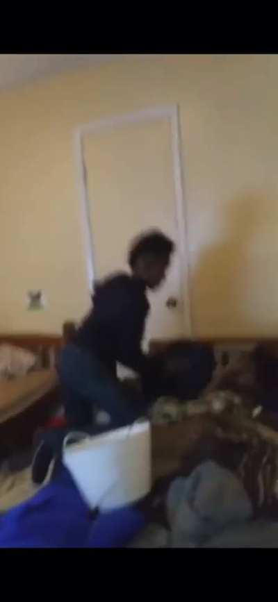 Pulls up pants in intimidation