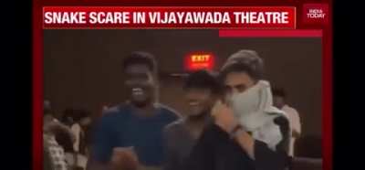 Indian movie fan brings a live snake to the screening of a Tollywood movie