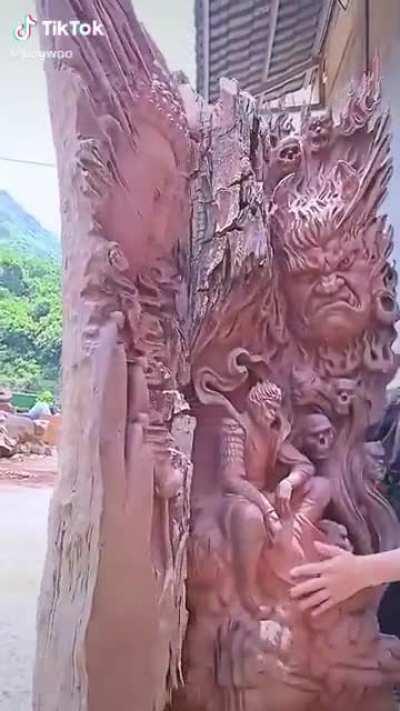 this guys carving in tree bark