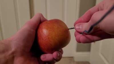 plugging headphones into an apple