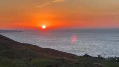 He's just drinking juice on the shore