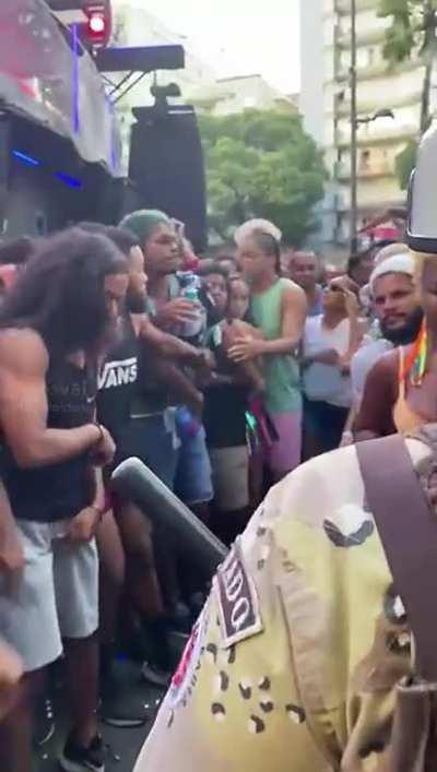 Police officers working at Carnival in Brazil like the sea open parting