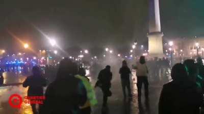Tonight from France, a man with a magic wand force the riot police to retreat. There is no joke.