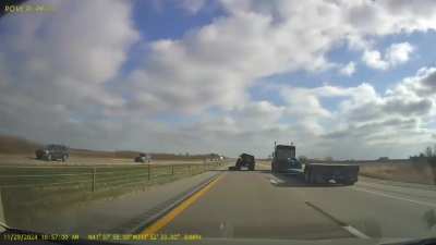 Truck flips over after hitting tractor wheel