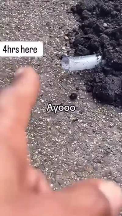 Folks gather around.. umm.. a guy that laid down in NYC street, buried alive with a breathing tube and a chess board on-top of him..