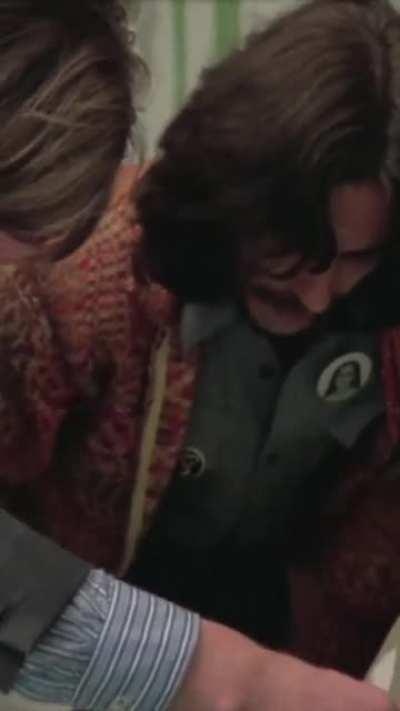 George Harrison and Paul McCartney sign the document of dissolution known as 'The Beatles Agreement' at the Plaza Hotel, NYC, December, 1974. Ringo Starr had previously signed in England. John Lennon later signed in Orlando, Florida while visiting Disney 