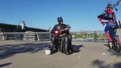 Batman playing ukulele