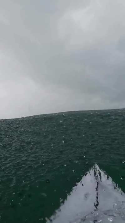 Far from shore, raining, and there's over a hundred feet of depth beneath you