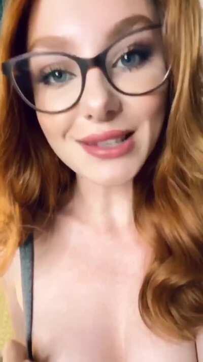 Sexy redhead in glasses