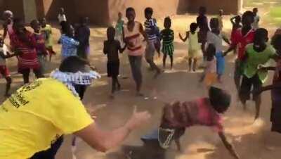 Humanitarian aid volunteer playing with children (link to original video in comments)