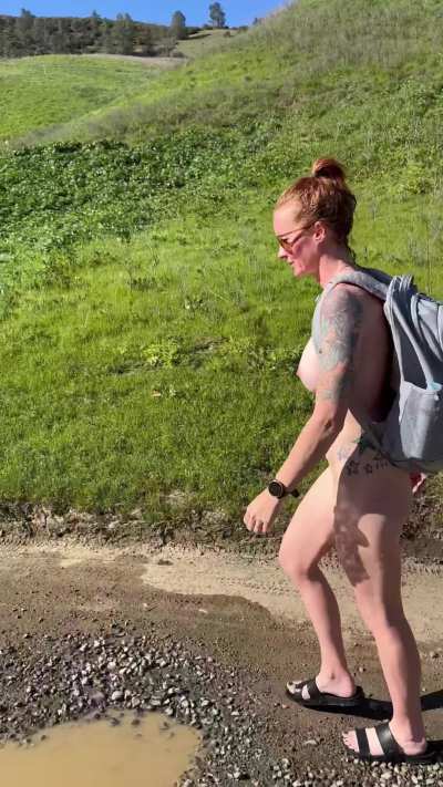 Nothing wrong with a little naked hike. Until a car comes. 