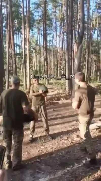 Ukrainian soldiers check the quality of helmets .
