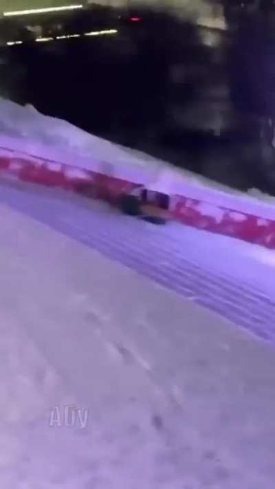 Sliding down snowy stairs with a pool float ring