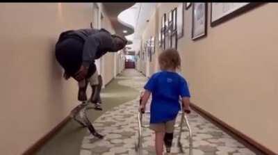 Paralympic medalist Blake Leeper motivating a 2 year old trying his prosthetic for the first time