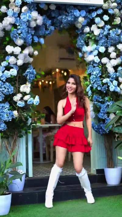 Angel Rai red dress