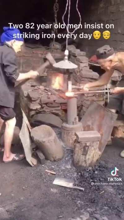 Even at 82 these two blacksmiths keep hammering away