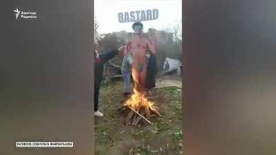 Kazakh women burn Borat cut out, ahead of it's worldwide premiere