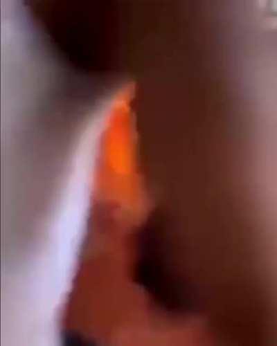 Rioters throwing molotov.