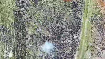 Two Russian soldiers on a motorcycle receiving two accurate grenade drops from Ukrainian 3rd Battalion, 79th Air Assault Brigade.