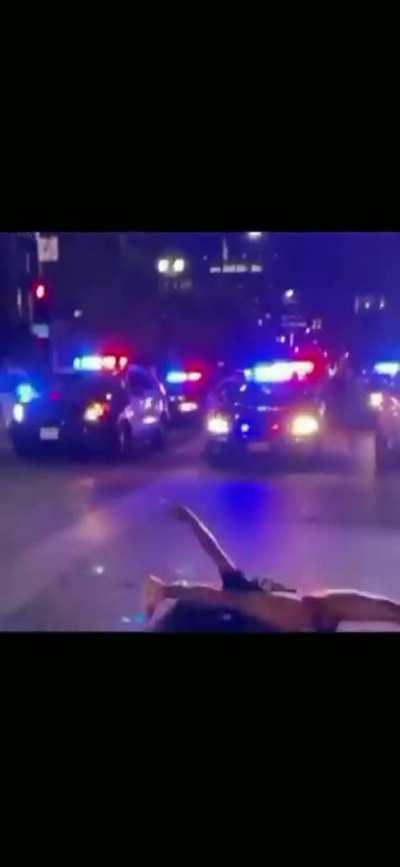 In front of the cops