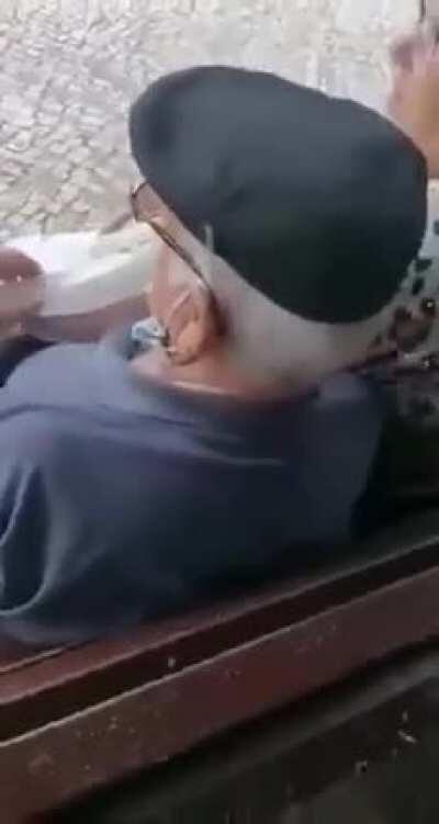 Grandma and grandpa sitting on a bench....