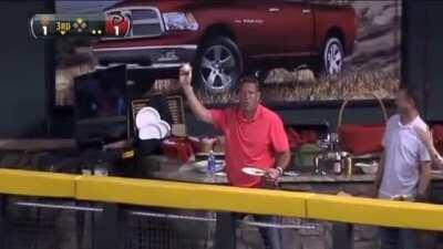 Basketball player Dan Majerle catches a baseball.