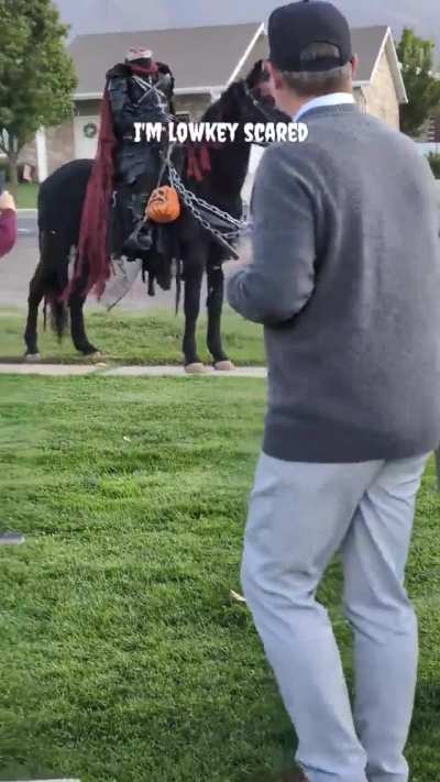Guy dressed as the Headless Horseman for Halloween