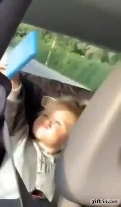 Kid gets caught taking a selfie.