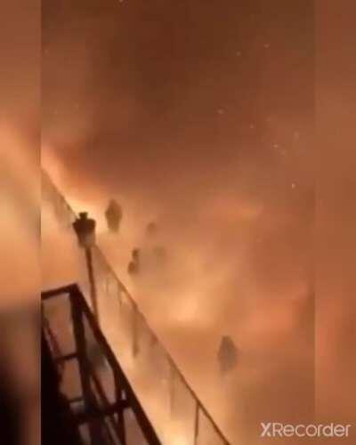 This fireworks extravaganza in a narrow street. Very festive response by the crowd