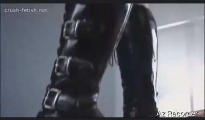 Half naked, she crushes a crayfish with her high-heeled boots.