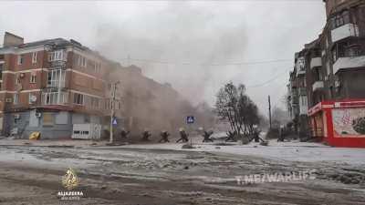 Al Jazeera news crew nearly struck by Russian artillery shells that hit nearby residential building in Bakhmut