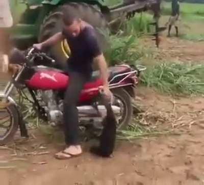 Chimp won't let go of the bike without taking him..