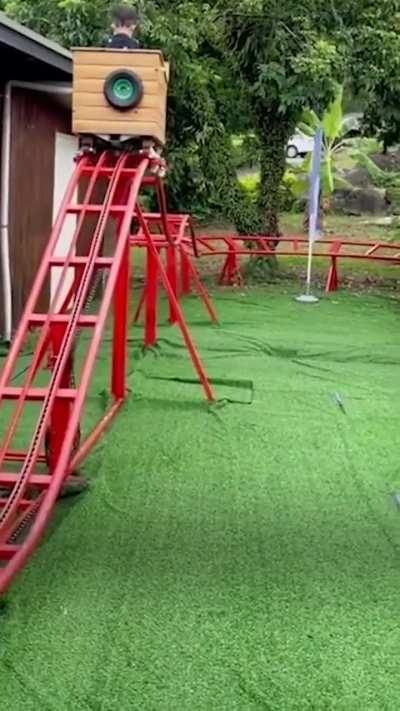 Dad build a homemade rollercoaster for his kid in back garden
